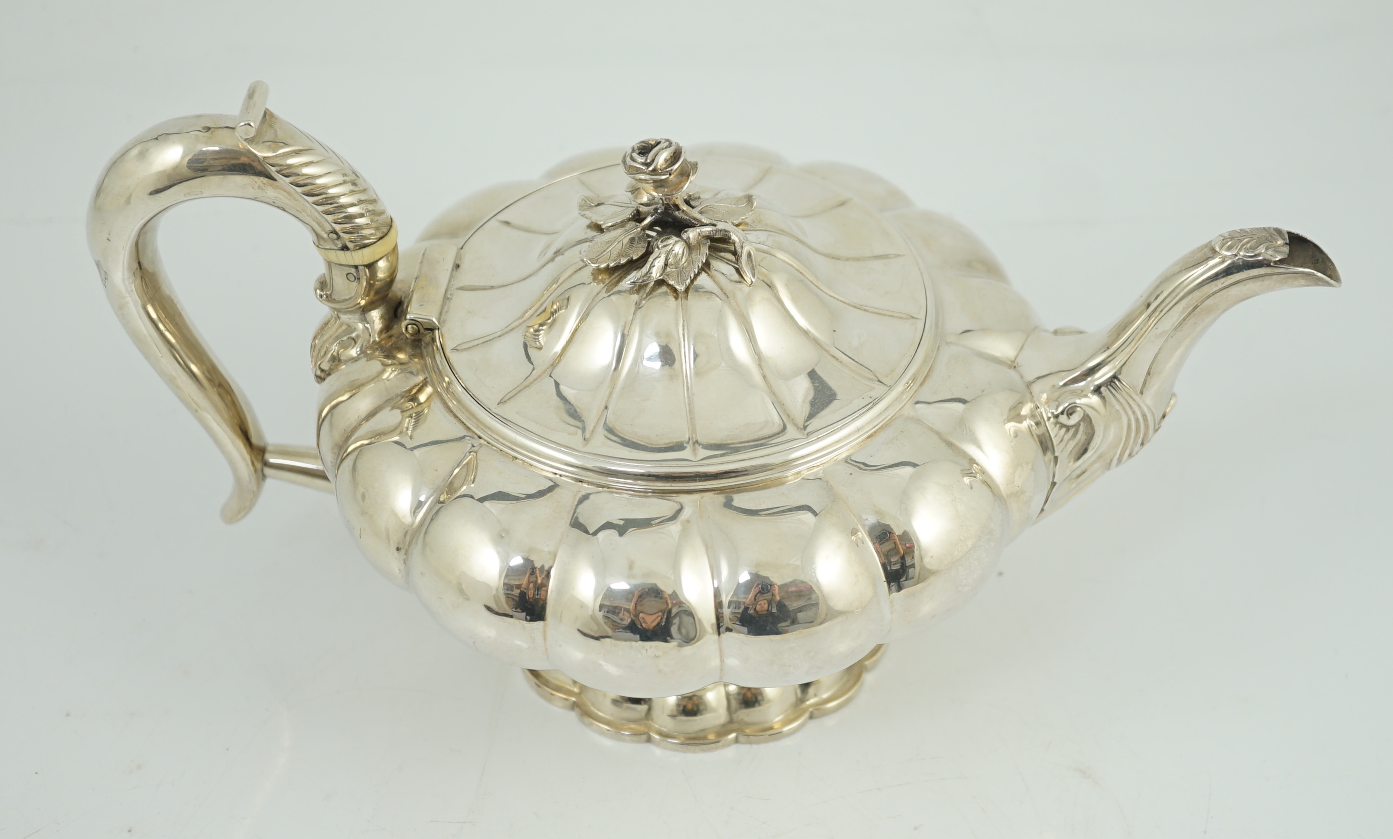 A George IV silver melon shaped pedestal teapot, by Joseph Angell I